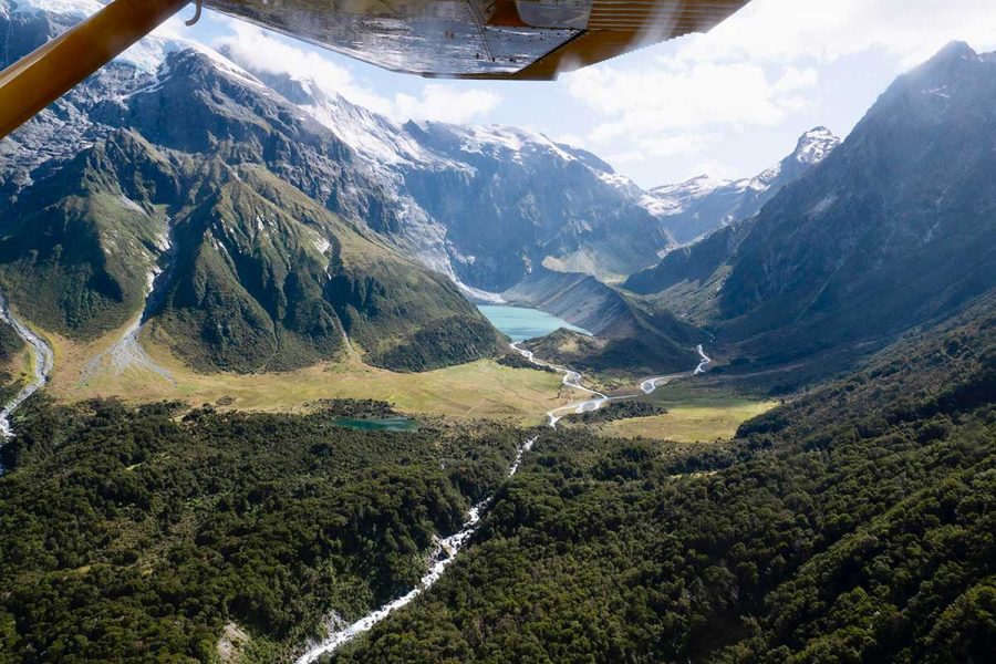 the siberia experience scenic flight looking up to the head of valley with small lake